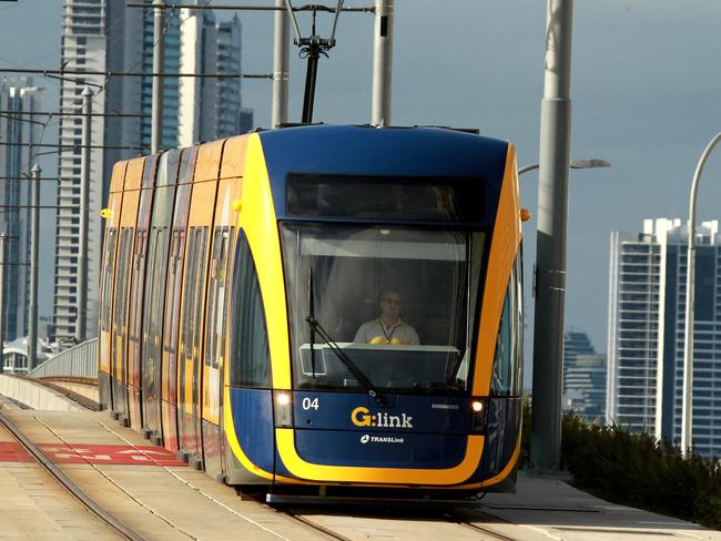 Gold Coast tram on the Southport Bridge . (sorry cloudy morning no sun ) . Picture Mike Batterham