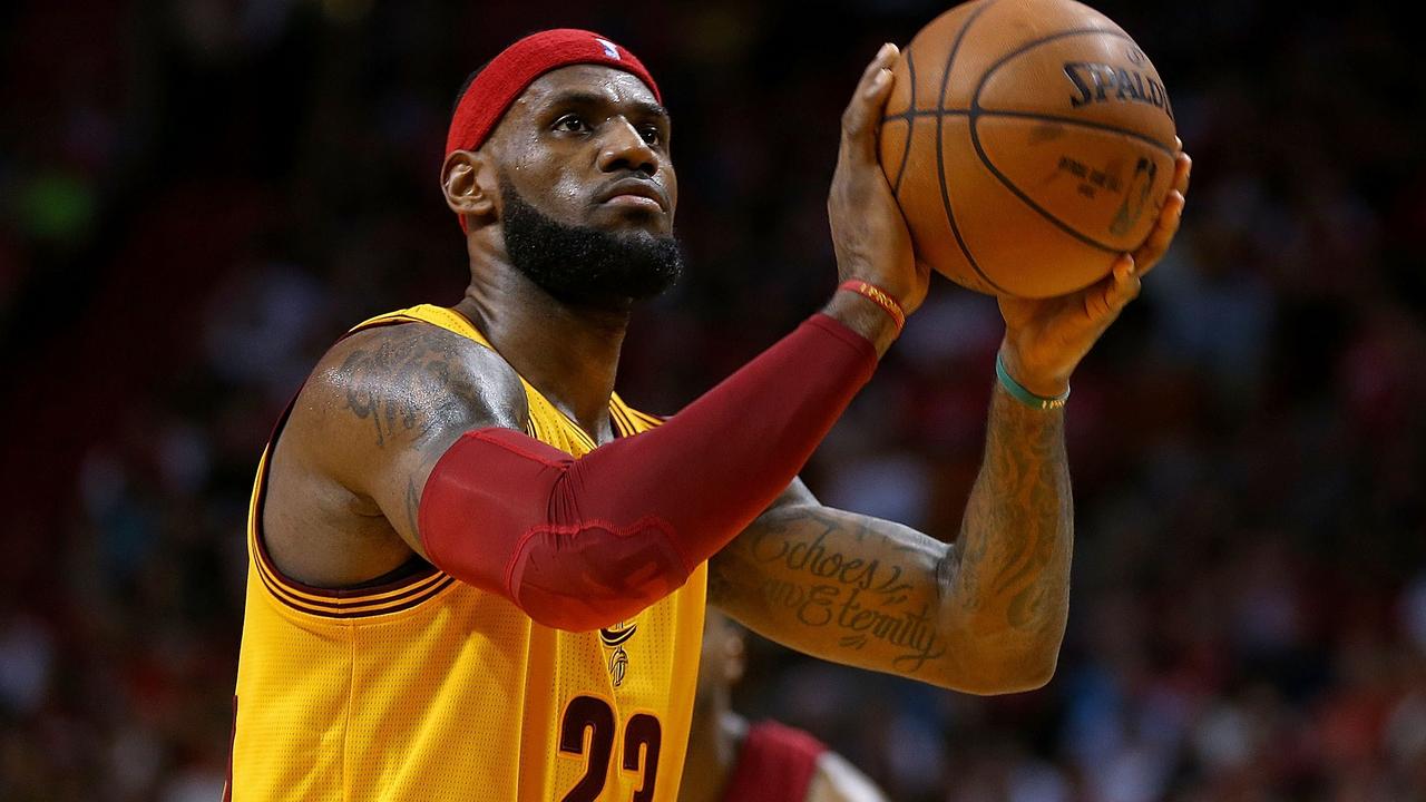 MIAMI, FL - DECEMBER 25: LeBron James #23 of the Cleveland Cavaliers shoots a foul shot during a game against the Miami Heat at American Airlines Arena on December 25, 2014 in Miami, Florida. NOTE TO USER: User expressly acknowledges and agrees that, by downloading and/or using this photograph, user is consenting to the terms and conditions of the Getty Images License Agreement. Mandatory copyright notice: Mike Ehrmann/Getty Images/AFP == FOR NEWSPAPERS, INTERNET, TELCOS & TELEVISION USE ONLY ==