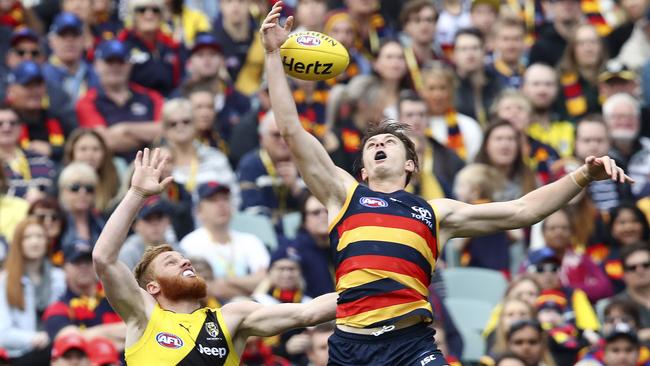 Jake Lever rises above Nick Vlastuin. Picture: Sarah Reed