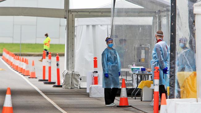 Health professionals wait for patients at an empty drive-through COVID testing site in Dandenong in the City of Casey. Picture: Aaron Francis