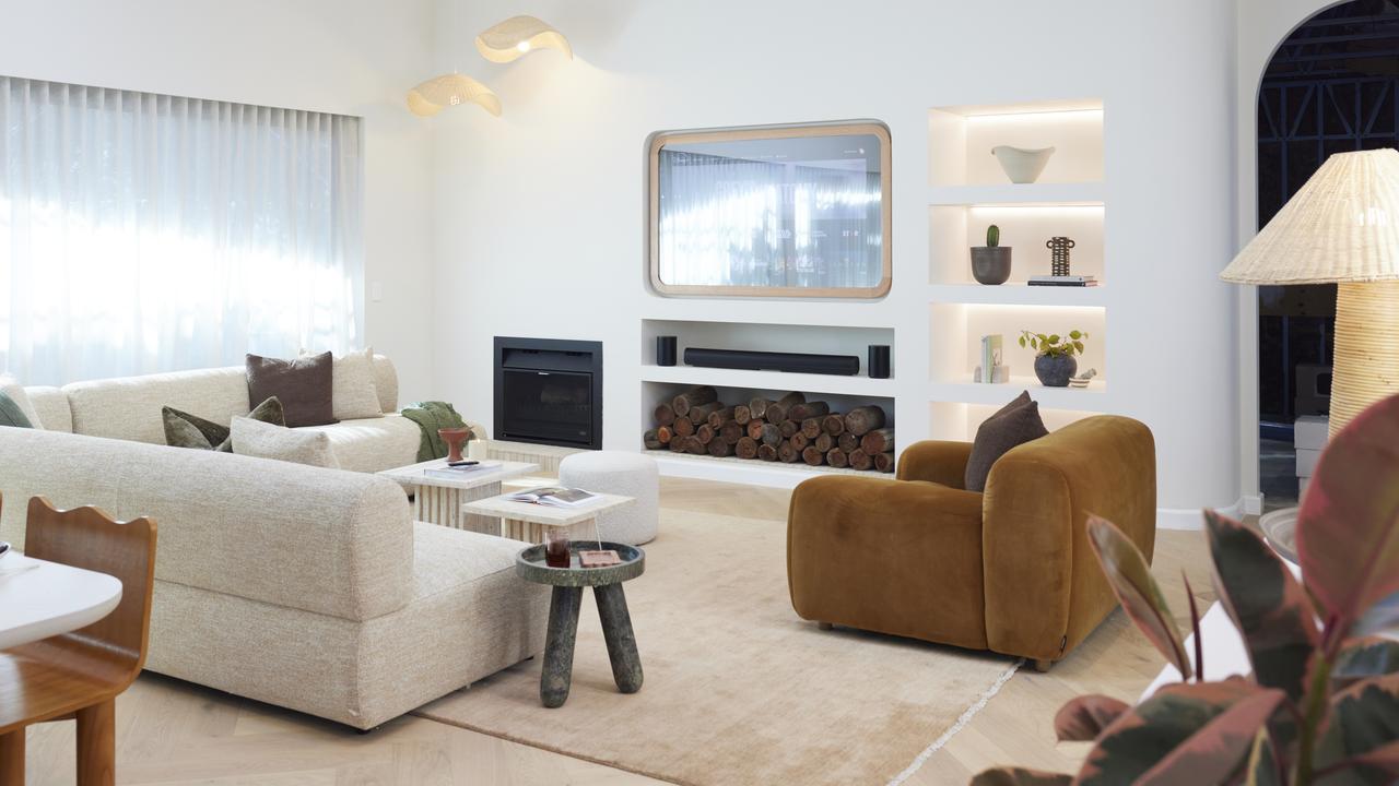 Courtney and Grant's living/dining room with its ill-placed fireplace.