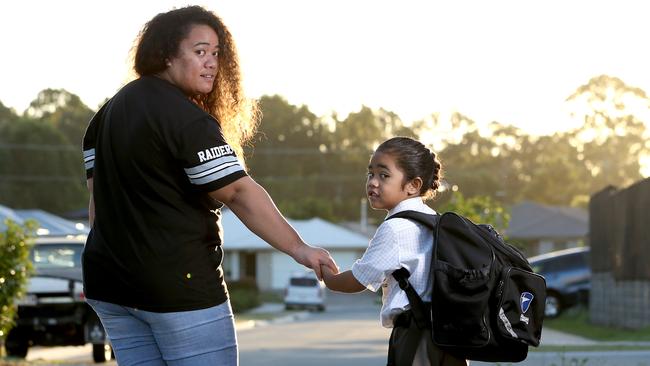 Wendy Taniela with her son Cyrus. Australian Christian College Moreton is appealing a ruling that he does not have to cut his hair.