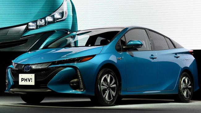 (FILES) This file photo taken on February 15, 2017 shows redesigned Toyota Prius PHV (plug-in hybrid vehicle) during a press conference in Tokyo. - Japanese car giant Toyota said on October 5, 2018 it is recalling more than 2.4 million hybrid cars over a fault that could cause crashes, just a month after an another recall affecting hybrids. (Photo by TORU YAMANAKA / AFP)