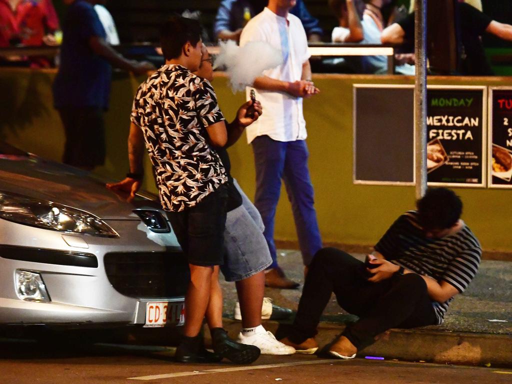 GOING: A young New Year's Eve reveller topples to the ground as his mates look on in the early hours of New Year's day