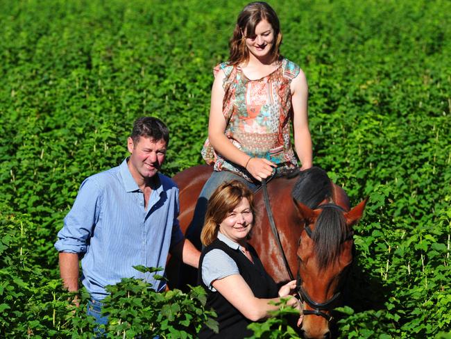 Jacoba and Mark Tromp with daughter Ella at their Silvan farm.