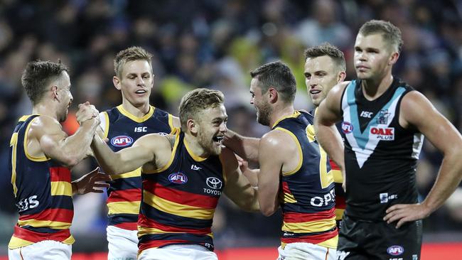 Crows players celebrate after Hugh Greenwood snaps a goal in Showdown 46. Picture SARAH REED