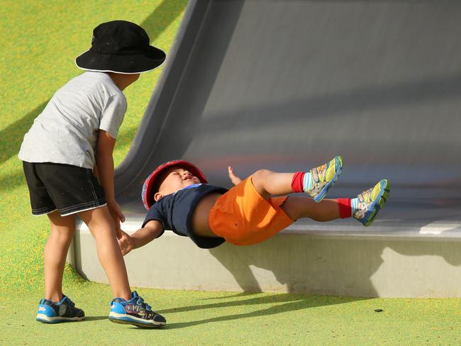 This youngster felt the full force of the landing off the fast slide. Picture: Sam Ruttyn