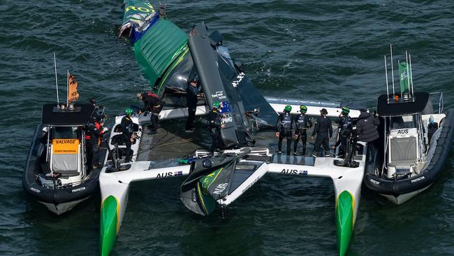 Australia SailGP Team helmed by Tom Slingsby are attended to by their support boat and safety teams after the main wing broke during racing on Race Day 2 of the Oracle San Francisco Sail Grand Prix held in San Francisco, California, USA. Sunday 23 March 2025. Rolex SailGP Championship Event 5 Season 2025. Photo: Simon Bruty for SailGP. Handout image supplied by SailGP