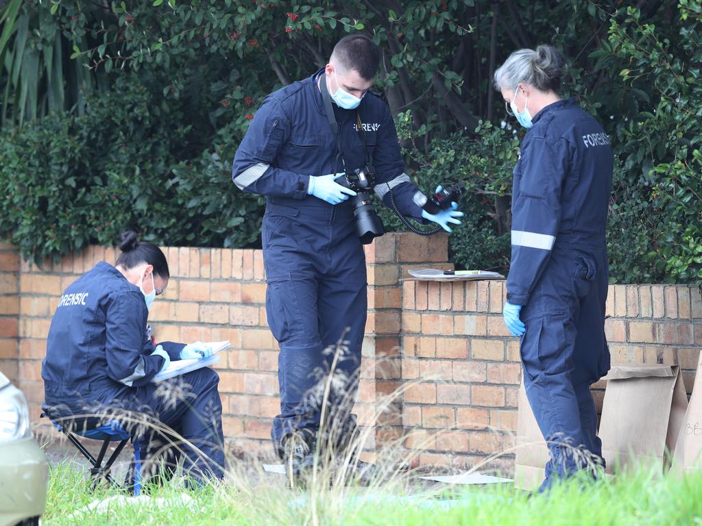 Forensic investigators probe the scene on North Rd. Picture: David Crosling