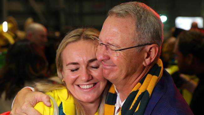 Ariarne Titmus hugs father Steve during the Australian Olympic Games athletes charter flight arrival at Sydney International Airport on August 14, 2024 in Sydney, Australia. Picture: Jason McCawley/Getty Images