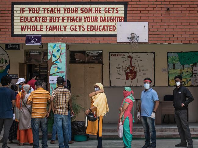 People in queue to receive their COVID-19 vaccinations in New Delhi, India. (Photo by Rebecca Conway/Getty Images)