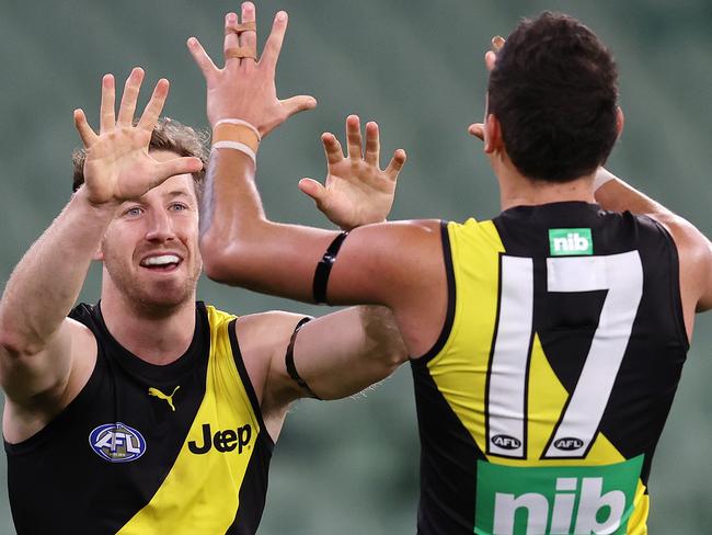 AFL Round 5. . 05/07/2020.  AFL Round 5. . 05/07/2020.  Melbourne v Richmond at the MCG. In game 100 Kane Lambert of the Tigers celebrates a late goal   . Pic: Michael Klein