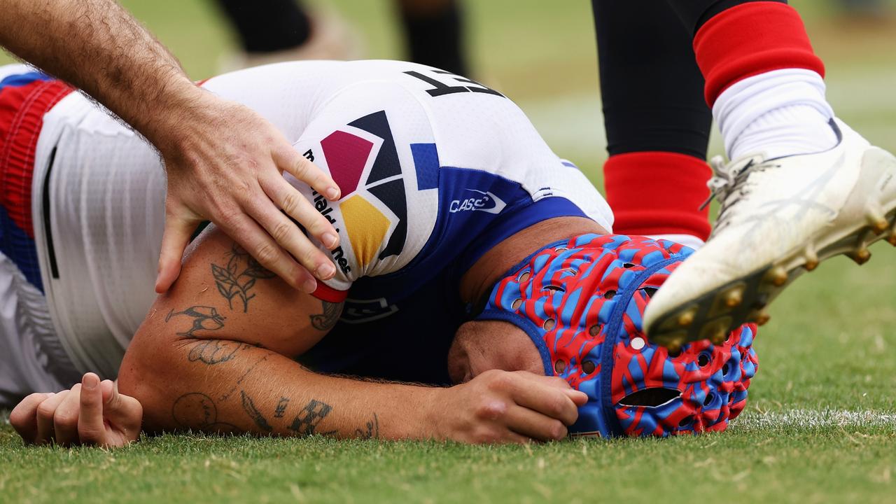 Kalyn Ponga concussed after colliding with Asu Kepaoa. Picture: Getty