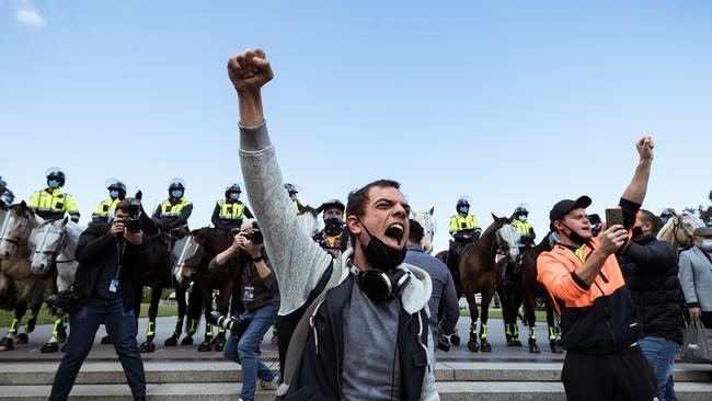 Anti-lockdown protesters gather at the Shrine of Remembrance in Melbourne on Saturday,