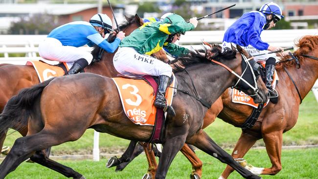 Ole Kirk and Willie Pike run down their rivals to claim the Caulfield Guineas.