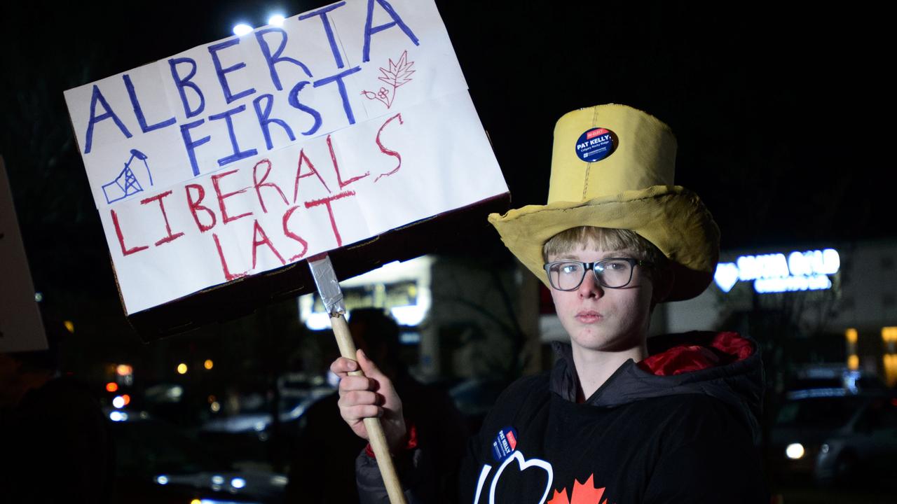 A protester outside Liberal leader Justin Trudeau's rally in Calgary in October. Picture: Sean Kilpatrick/The Canadian Press via AP.