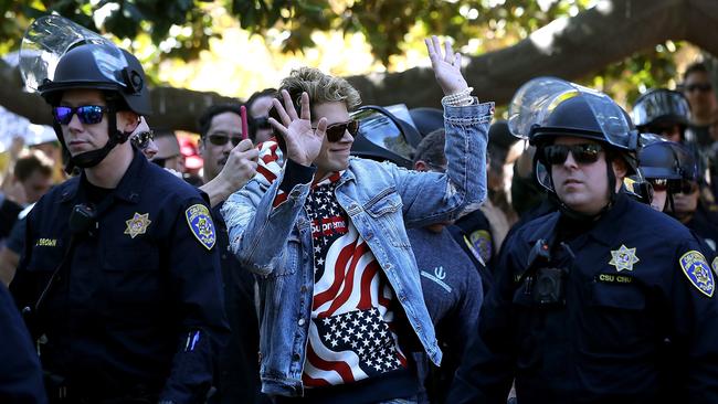 Milo needs a police escort after speaking at a free speech rally at U.C. Berkeley in Berkeley, California. Picture: Getty Images