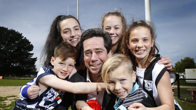 AFL chief Gillon McLachlan get thanks from junior country footballer representatives Tom, Alexandra, Jasmine, Jaska and Coco on changes to country footy governance and support. Picture: David Caird