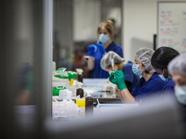 Staff are seen preparing vaccine doses inside the Melbourne Exhibition Centre COVID-19 Vaccination Centre. Picture: Getty Images