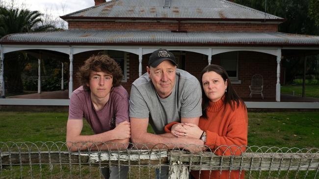 Victim Shane Newton with his son Tom and wife Robyn at their Everton home.