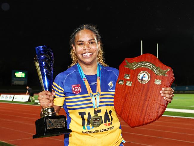 Cairns Kangaroos captain Genavie Tabuai holds aloft the winner's shield and the player of the match trophy after winning the Far North Queensland Rugby League (FNQRL) women's grand final match against the Atherton Roosters at Barlow Park. Picture: Brendan Radke