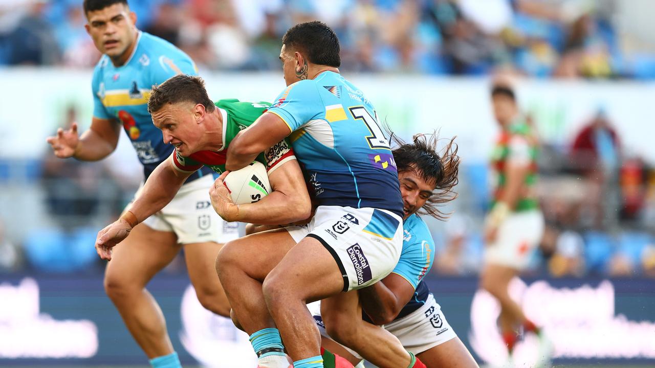 GOLD COAST, AUSTRALIA - JUNE 08: Jack Wighton of the Rabbitohs is tackled during the round 14 NRL match between Gold Coast Titans and South Sydney Rabbitohs at Cbus Super Stadium, on June 08, 2024, in Gold Coast, Australia. (Photo by Chris Hyde/Getty Images)