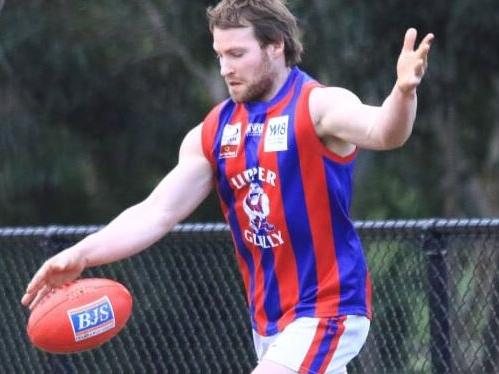 Bryce Hards gets a kick away for Upper Ferntree Gully in the Eastern Football League (EFL). Picture Davis Harrigan