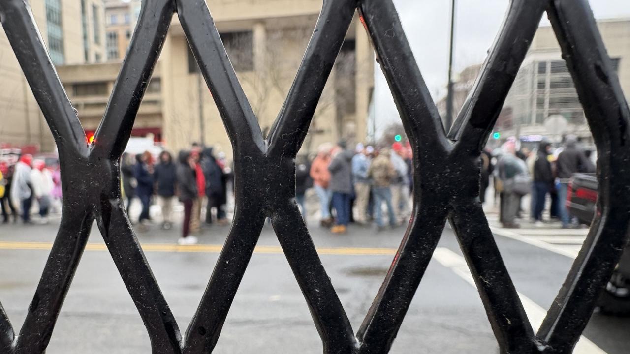 Security was heavy as people queued to get into the Capital One Arena in Washington DC to see Donald Trump. Picture: Benedict Brook.