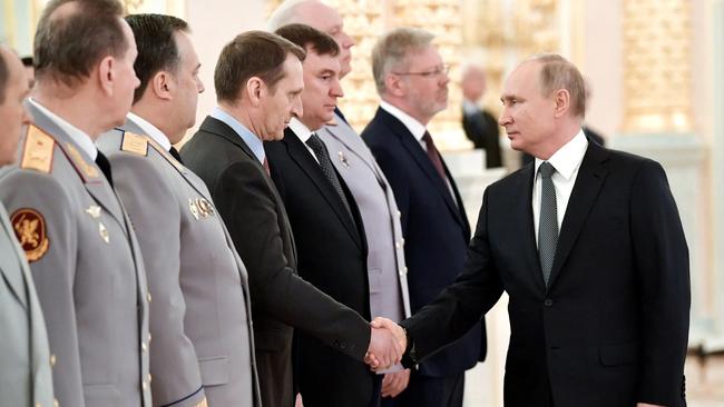 President Vladimir Putin of Russia shaking hands with Sergei Naryshkin, head of the Russian Foreign Intelligence Service, at an event last year at the Kremlin. Picture: Alexey Nikolsky/Agence France-Presse/Getty Images