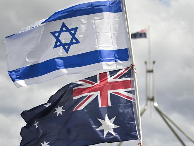 CANBERRA, Australia - NewsWire Photos - October 7, 2024: Thousands of attendees gather at Parliament House in Canberra taking an historic stand against antisemitism and to stand in support of Israel.  Picture: NewsWire / Martin Ollman