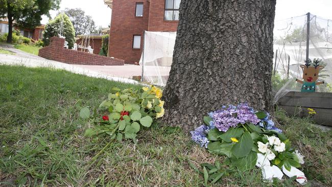 Flowers under a tree outside the Balinga Ct home where two people were killed in a balcony collapse on December 16, 2017. File picture: Andrew Tauber