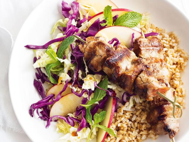 Ginger and tamari pork skewers with cabbage, apple and herb salad.