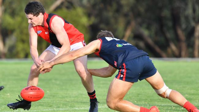 Morphett Vale’s Connor Lock (front) battles Flagstaff Hill’s Jarrad Lobasso in a game last year. The Emus are without a coach after the board dumped ex-mentor David Murdock. Picture: AAP/ Keryn Stevens)