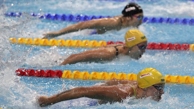 Sweden’s gold medal winner Sarah Sjostrom, front, Australia's Emma McKeon and Japan’s Runa Imai across the pool. Picture: AP.