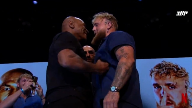 Mike Tyson pretends to punch Jake Paul during official face off