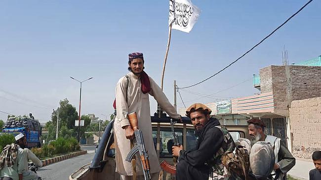 Taliban fighters drive an Afghan National Army (ANA) vehicle through the streets of Laghman province. Picture: AFP