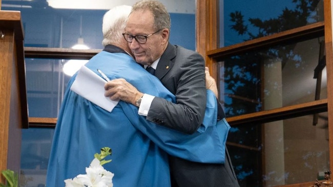 Somerset College Chairman Tony Hickey embraces outgoing headmaster Craig Bassingthwaighte