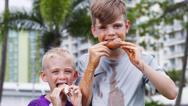 The hot and humid weather that Cairns is experiencing is perfect for cool, tasty treats like ice cream enjoyed outdoors. Bentley Park brothers Kody Neale, 5, and Kai Neale, 10, enjoy some ice cream from Gellochio on the Cairns Esplanade, and have a hard time getting all of the sweet treat in their mouths before the heat melts it away. Picture: Brendan Radke