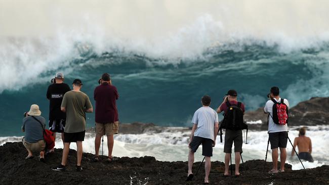 Photographes are seen at Snapper Rocks on the Gold Coast , Thursday February 21, 2019. Huge swells and high tides are set to pummelling south-east Queensland beaches over the coming days as Cyclone Oma tracks towards the Queensland coast. Photo: Dave Hunt/AAP.