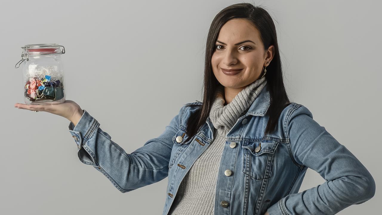 Zero Waste Big Read - Cover pic for city. (Stephanie Timotheou) holding a glass/plastic jar filled with my kitchen waste from the week.22nd June 2018. AAP Roy VanDerVegt