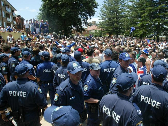 Police attempt to control the growing crowd.