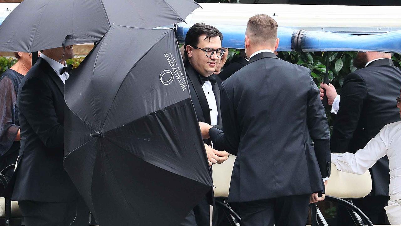 Groomsmen attempted to shield Mr Sharaz from waiting media. Picture: NewsWire/Tertius Pickard