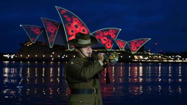 A Remembrance Day dawn service with poppies projected on the shells of the Sydney Opera House. Picture: NewsWire / Gaye Gerard