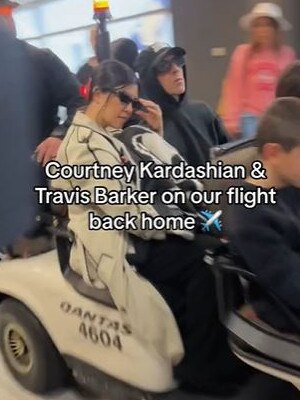 The famous family were driven in an airport buggy in the terminal.