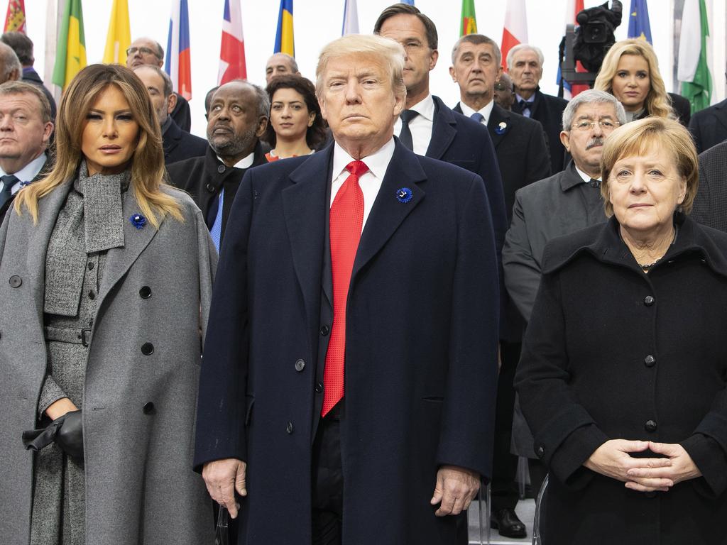 Melania Trump, Donald Trump and German Chancellor Angela Merkel during the commemoration ceremony of the 100th anniversary since the end of World War I on November 11, 2018 in Paris. Picture: Guido Bergmann/Bundesregierung via Getty Images