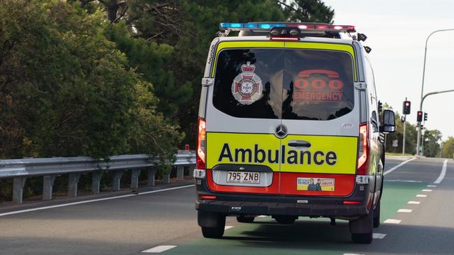 A teenager has been rushed to hospital after falling about six metres from a rock wall near the University of Queensland campus this morning.