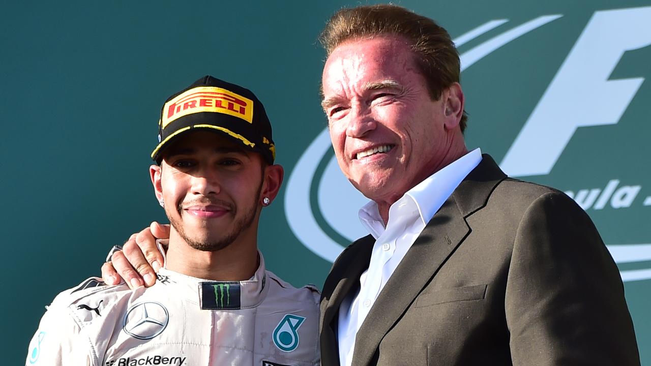 Hamilton with Arnold Schwarzenegger after winning the Australian Formula One Grand Prix in 2015. Photo: AAP Image/Julian Smith