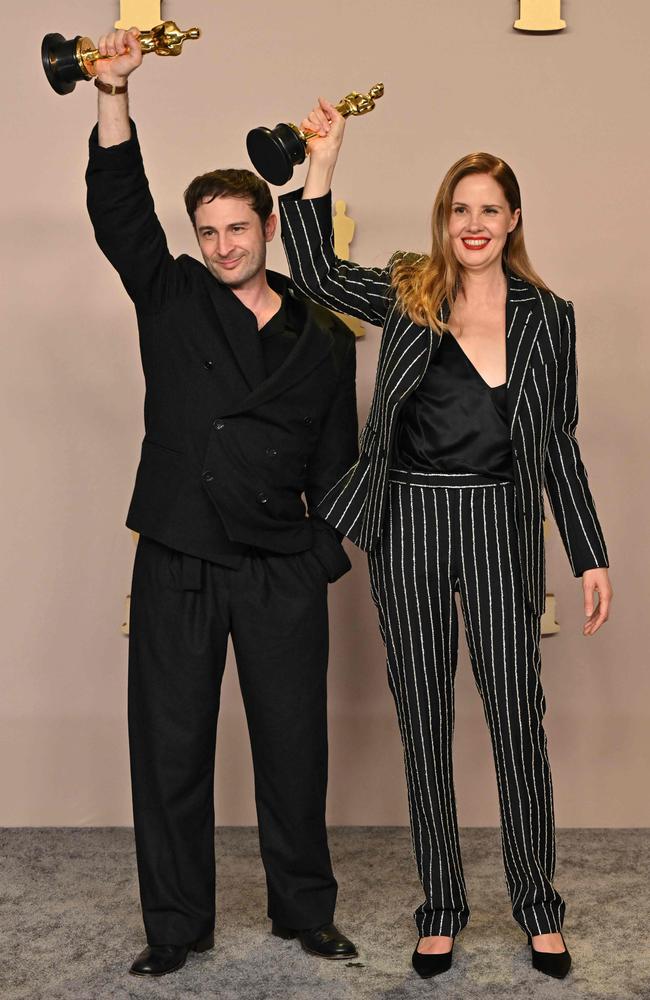 French director and screenwriter Justine Triet and Arthur Harari pose in the press room with the Oscar for Best Original Screenplay for "Anatomy of a Fall". Picture: AFP