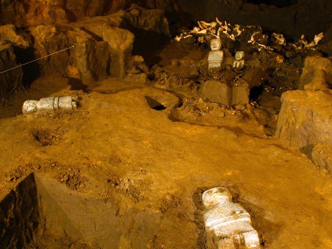 Incredible find ... These four stone sculptures and a jade ornament were among the relics uncovered in the excavation.