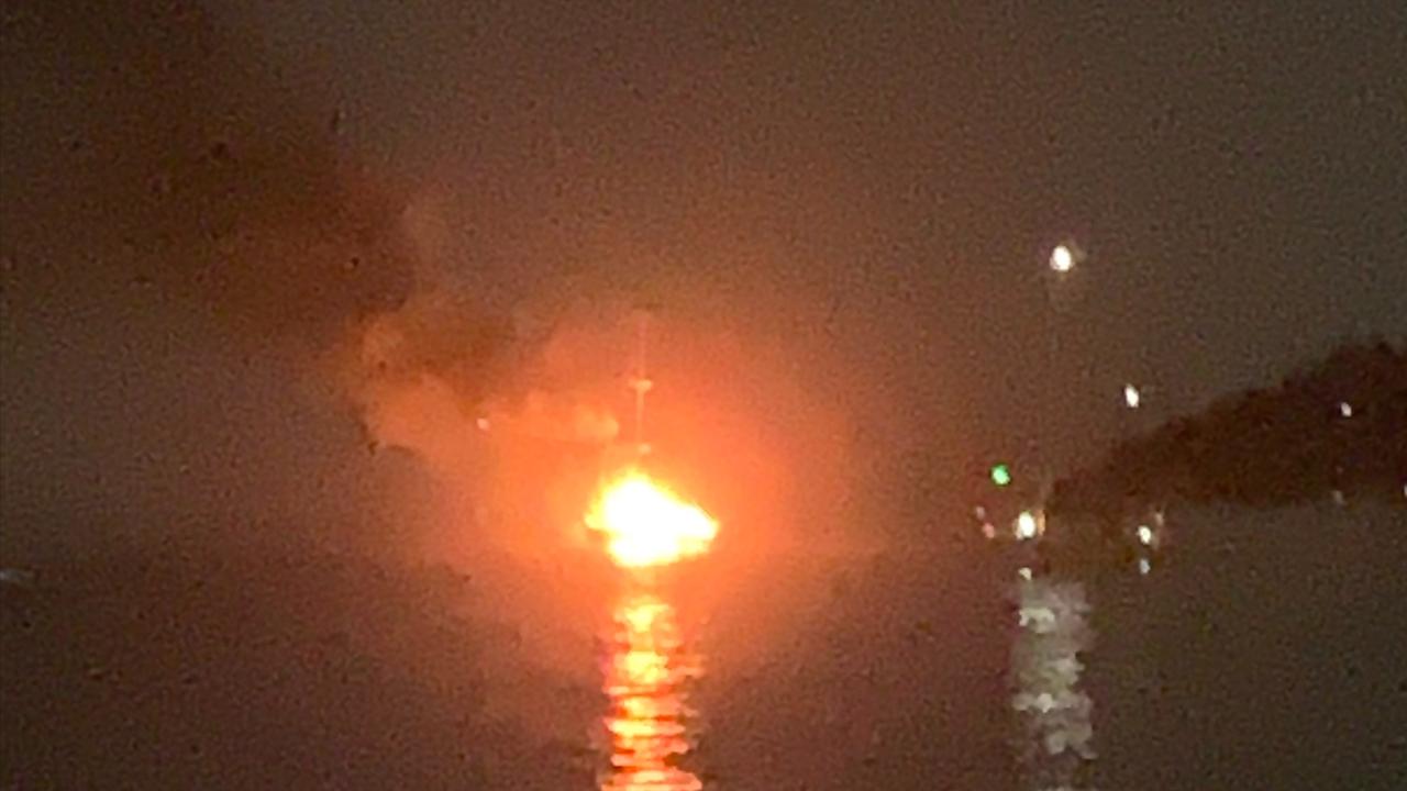 Woman under police guard in hospital after boat explodes off Airlie ...